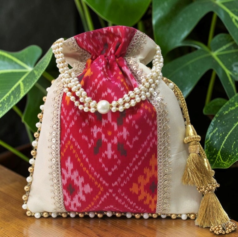 Patola Ikat & Tissue Silk Potli Bag – Dark Pink | Handcrafted with Pearl Handle & Gold Tassels