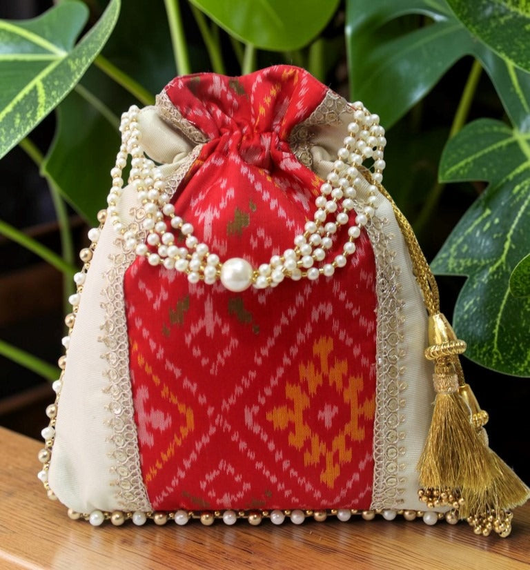 Patola Ikat & Tissue Silk Potli Bag – Red | Handcrafted with Pearl Handle & Gold Tassels