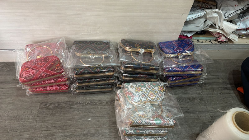 Sache clutches packed for a customer order