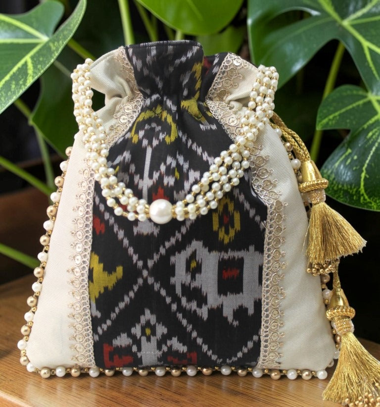 Patola Ikat & Tissue Silk Potli Bag – Black Multicolour | Handcrafted with Pearl Handle & Gold Tassels