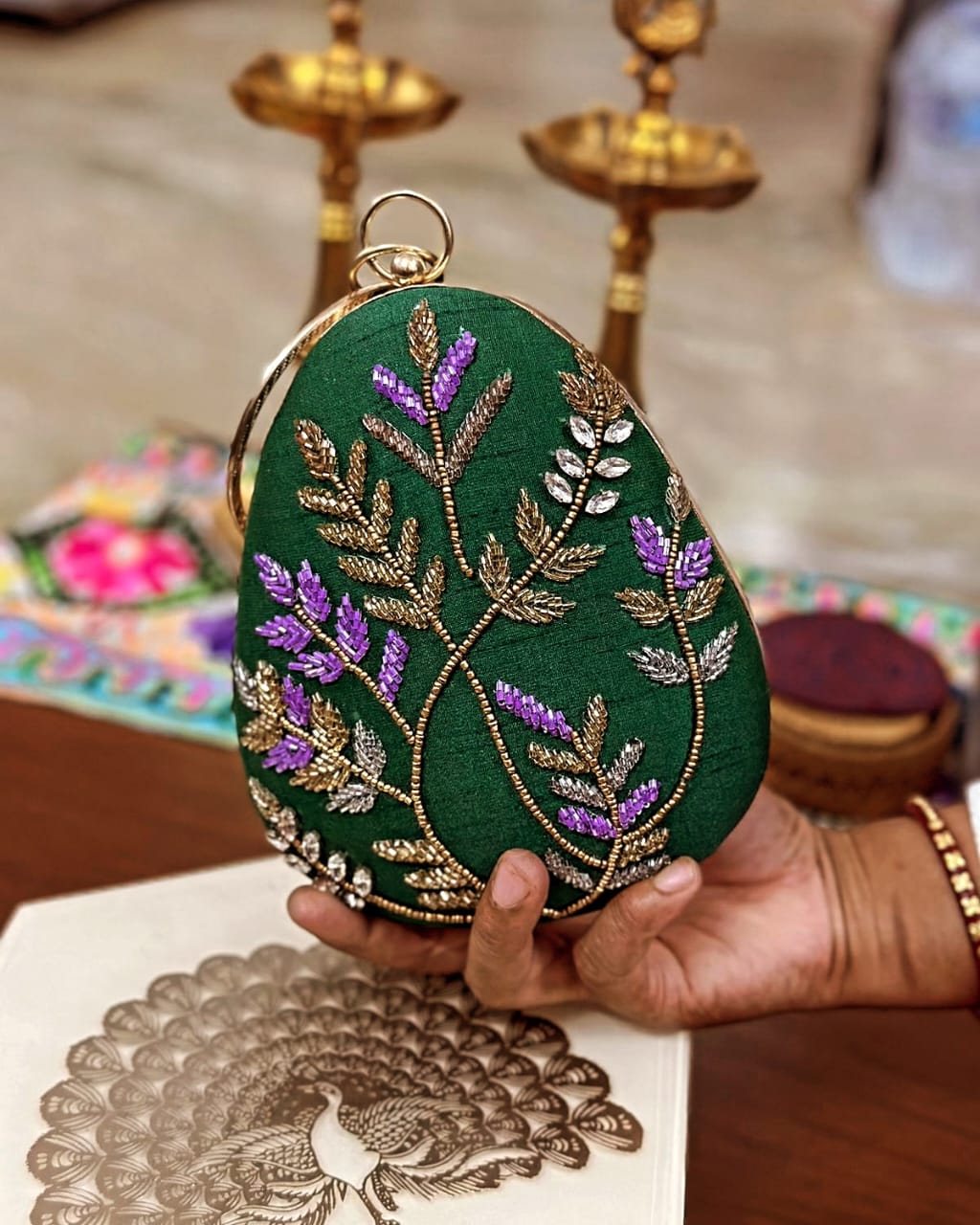 Green fern embroidered egg clutch with gold bangle handle, wedding evening bag
