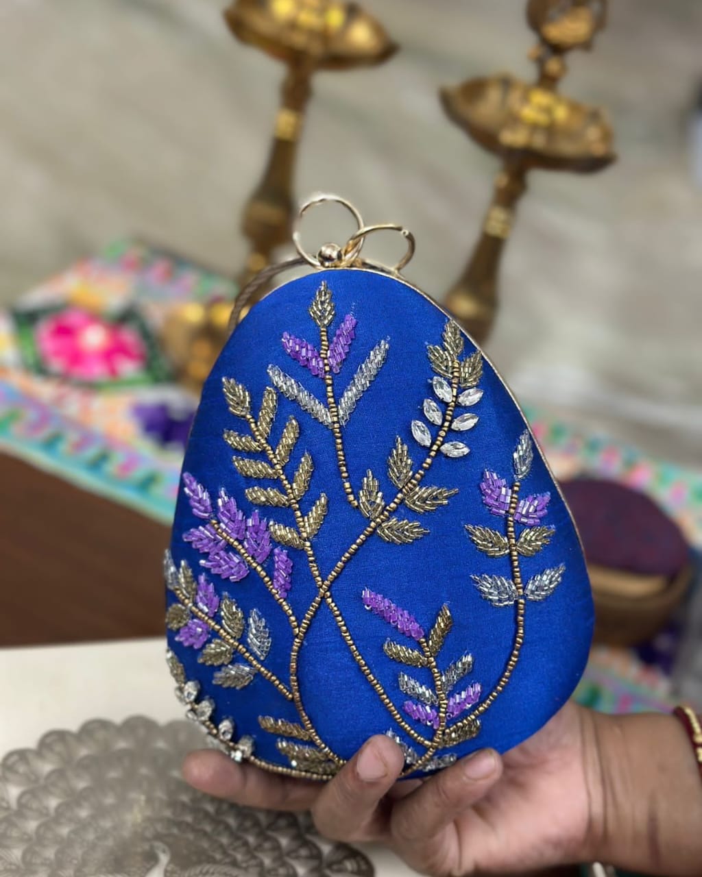 Royal blue fern embroidered egg clutch with gold bangle handle, wedding evening bag