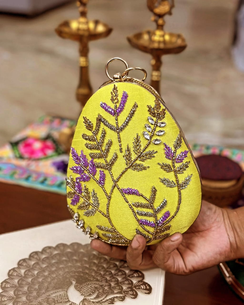 Yellow fern embroidered egg clutch with gold bangle handle, wedding evening bag