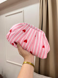 Pink and white striped pleated clutch with red heart embroidery