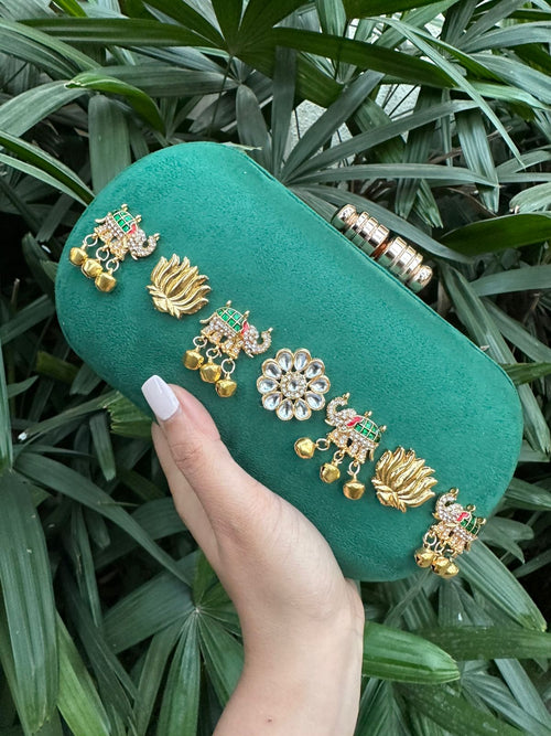 Box clutch in kundan-embellished ivory suede, front view with pearl gajra handle
