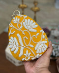 Mustard pearl beaded floral egg clutch with gold bangle handle, wedding evening bag
