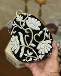 Black pearl beaded floral egg clutch with gold bangle handle, wedding evening bag