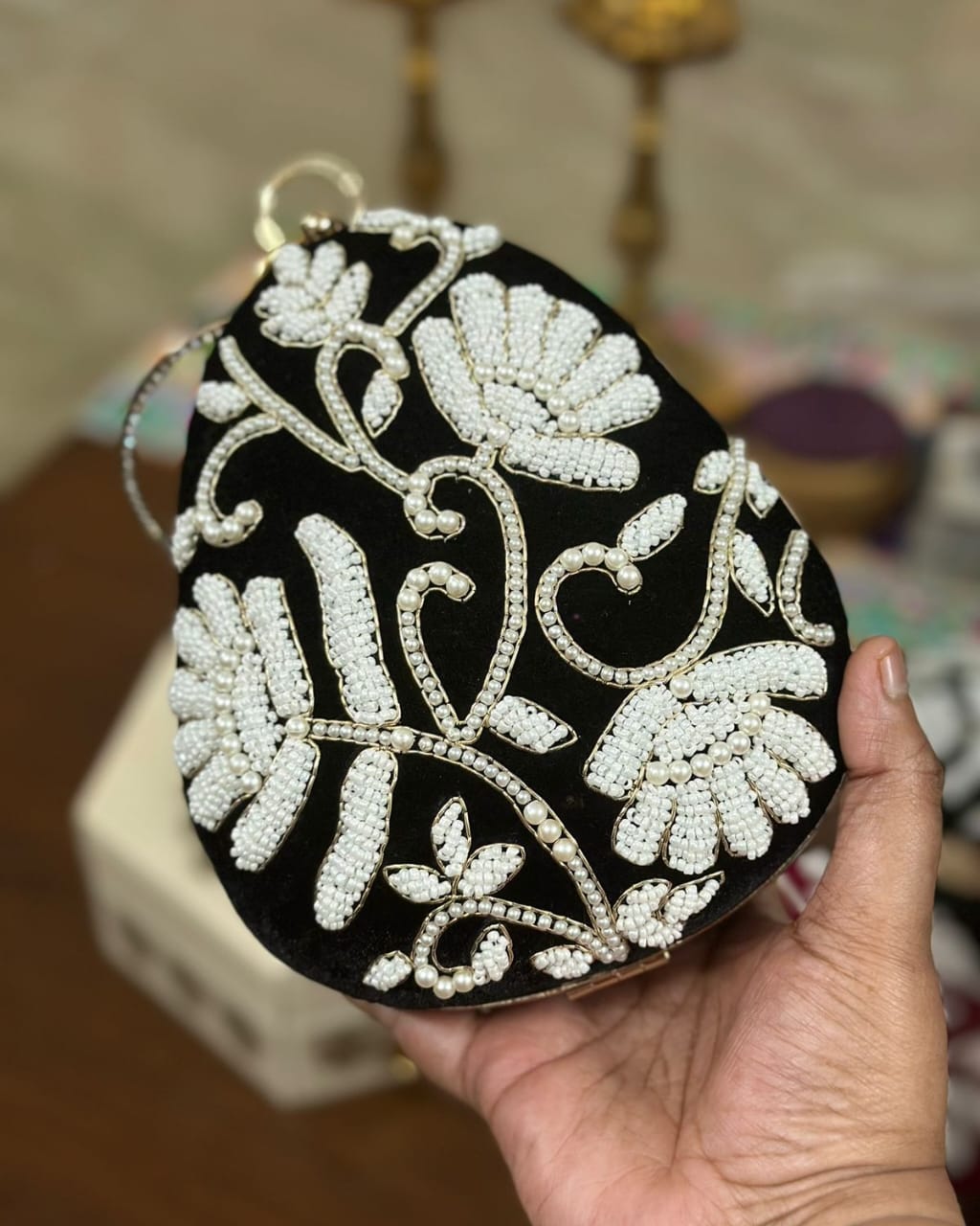 Black pearl beaded floral egg clutch with gold bangle handle, wedding evening bag