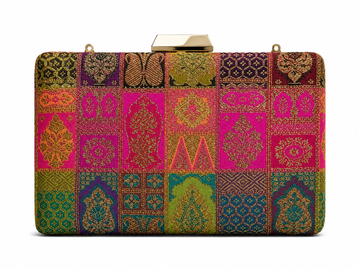 Kiran Banarasi patchwork box clutch in magenta and emerald green silk with gold zari motifs