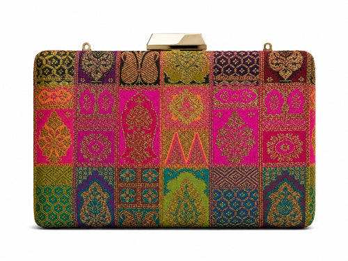 Kiran Banarasi patchwork box clutch in magenta and emerald green silk with gold zari motifs